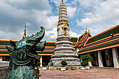 Bangkok Wat Pho, phra prang tower at the corner of the courtyard around the bot.